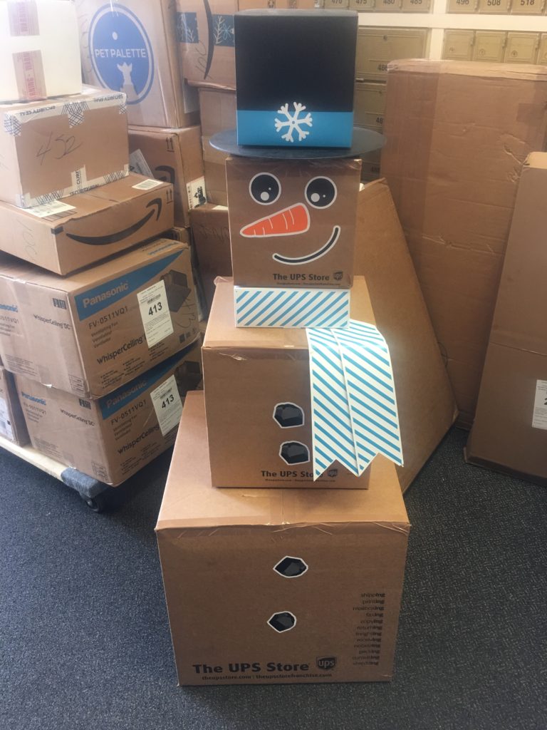 Photo taken at local UPS store with boxes stacked and decorated like a snowman. So cute!!
