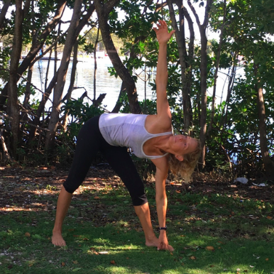 Jennifer in Triangle Pose opening her heart and quieting her mind.