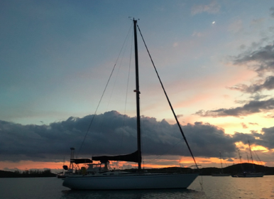 Sailing Vessel First Light, a side view at sunset.