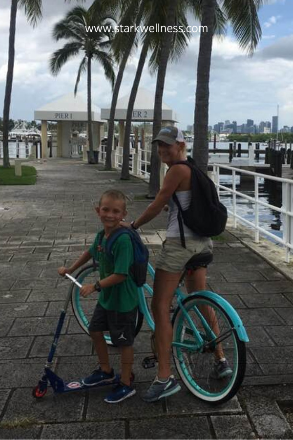 Life and Holistic Health Coach Jennifer and son Wilson on bike ride at Dinner Key Marina in Miami, Florida --www.starkwellness.com