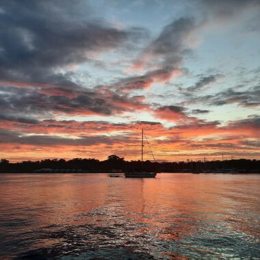 My sailboat home on the water at sunset.