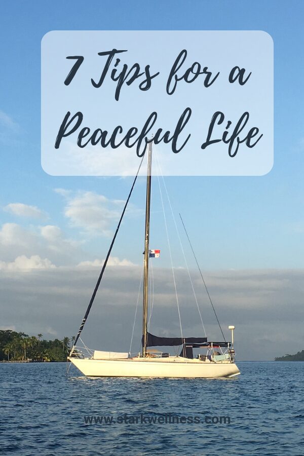Bog post title "7 Tips for a Peaceful Life" with my sailboat home in the background --www.starkwellness.com