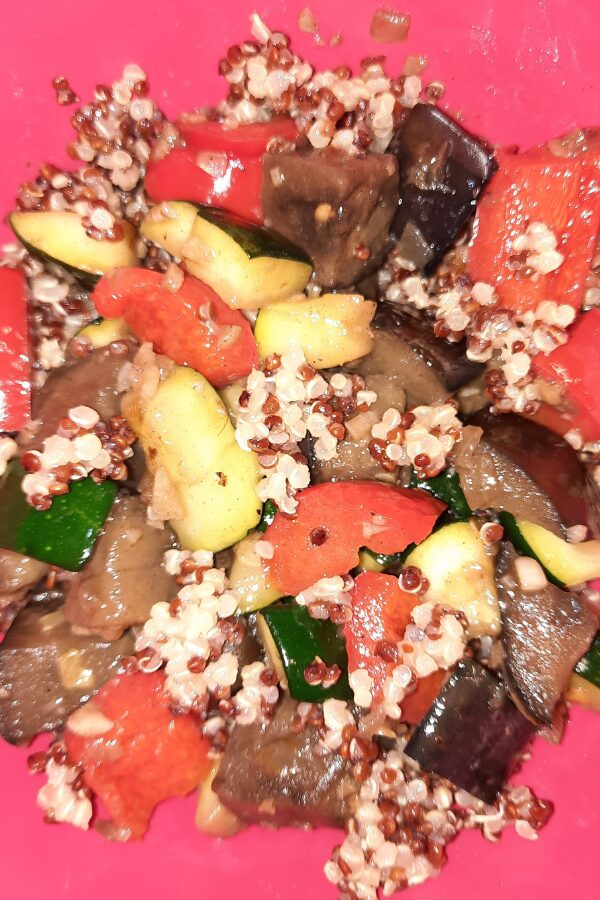 Delicious quinoa bowl wtih bell peppers, zucchini, and eggplant.
